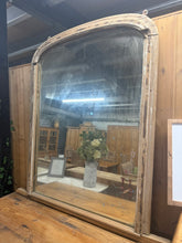 Load image into Gallery viewer, This beautiful antique over mantle mirror remains sturdy and well-preserved for its age. It features several marks and chips that enhance its delightful rustic character. The mirror also shows some lovely patina, adding to its vintage charm.

Overall Dimensions

101cm wide x 105cm high

DELIVERY AVAILABLE      

For our other items see our website https://fossewayfurniture.co.uk

collection from our shop at cv36, our collection zone at bs36 or otherwise delivery is available

