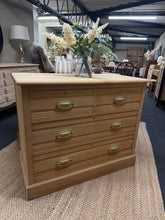 Load image into Gallery viewer, This charming stripped satinwood chest of drawers combines solid construction with timeless appeal. Featuring dovetail-jointed craftsmanship, it offers practical storage with two short drawers over two spacious long drawers. Recently stripped to bare wood, the piece is structurally sound and ready for your finishing touch—a light wax coat will enhance the natural grain and provide lasting protection. Perfect for bedroom or hallway storage with character and durability.

Delivery Available

Overall Dimension
