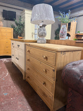 Load image into Gallery viewer, This solid pine chest of drawers has been stripped back to its natural state so may need a coat of wax for protection. It has ample storage with four long dovetail jointed drawers. It is structrually sound and in good overall condition.

Delivery Available

Overall Dimensions

91cm wide x 43cm deep x 80cm high

