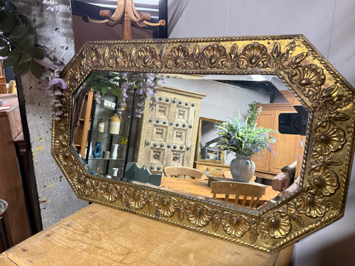 This beautiful mirror features a bold gold chunky frame and is sturdy and well-maintained. Its beveled edges enhance its graceful look, and it comes with a long chain for easy hanging.

Delivery Available

Overall Dimensions

74cm wide x 44cm high
