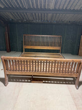 Load image into Gallery viewer, A striking Super King sleigh bed crafted from solid pine, offering generous sleeping space with classic character. Structurally sound and in good working condition with minor cosmetic marks consistent with pre-owned furniture. The elegant sleigh design serves as an impressive focal point for any bedroom, combining traditional craftsmanship with practical comfort. Takes a 6ft mattress.

Delivery Available

Overall Dimensions

189cm wide x 241cm long&nbsp;

headboard height : 121cm&nbsp;

footboard height : 8
