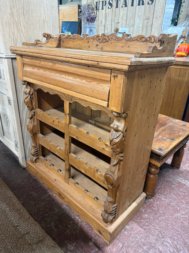 This charming solid pine wine rack holds 18 bottles and features a sturdy gallery back design. It includes a spacious drawer for extra storage. While it's previously used and shows some minor marks, it remains in great overall condition.

Overall Dimensions

81.5cm wide x 39cm deep x 99.5cm high

DELIVERY AVAILABLE      

For our other items see our website https://fossewayfurniture.co.uk

collection from our shop at CV36 4QZ or purchase online for delivery.
