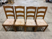 Load image into Gallery viewer, A set of four ladder-back dining chairs offering reliable seating for your dining space. These pre-loved pieces are structurally solid and well-maintained, with the natural patina that comes from everyday use. Minor surface marks are present but don't detract from their functionality or appeal. Ideal for those seeking vintage character without compromise on durability.

Delivery Available

Overall Dimensions

approx : 45cm wide x 42cm deep x 102cm high / 47cm seat height&nbsp;]
