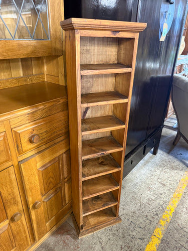 This delightful narrow bookcase crafted from solid pine is strong and generally well-maintained. While it has been gently used and has a few small marks, they are hardly noticeable. With seven fixed shelves, it provides ample room to showcase your favourite books and keepsakes.

Delivery Available

Overall Dimensions

33cm wide x 19cm deep x 127cm high     
