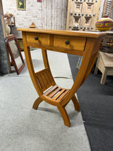 Load image into Gallery viewer, Solid Indonesian teak kartini console table built to withstand daily use. The frame is structurally robust with authentic dovetail-jointed drawers and a convenient lower shelf for storing essentials. Surface wear and minor marks reflect its history, but nothing compromises functionality or appeal. A reliable, well-made piece with genuine character.

Delivery Available

Overall Dimensions

61cm wide x 30cm deep x 75.5cm high

