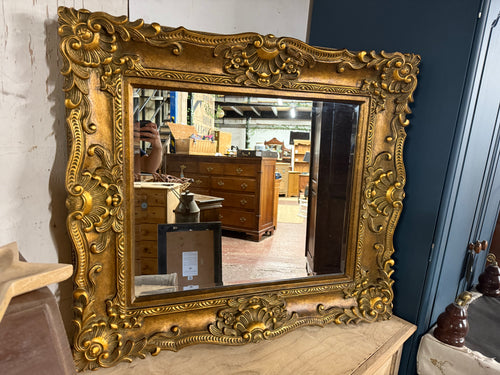 This beautiful large gilt-framed mirror adds a touch of timeless elegance to any room. Featuring a bevelled edge that enhances its classic appeal, the mirror is structurally solid and well-maintained. While it is a pre-loved piece with a few minor marks, these subtle signs of character only add to its charm. Perfect for brightening spaces and creating a sense of openness, this mirror combines vintage style with practical function, making it a delightful addition to your home décor.

Delivery Available

Over