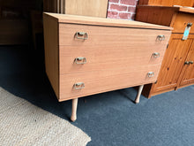 Load image into Gallery viewer, This teak chest features three spacious drawers ideal for bedroom or living room storage. The wood has been stripped to bare finish, showcasing its natural character—a light wax application will help protect and enhance the surface. The piece is structurally sound and in excellent working condition, ready for immediate use.

Delivery Available

Overall Dimensions

82cm wide x 43cm deep x 66.5cm high&nbsp;&nbsp;


