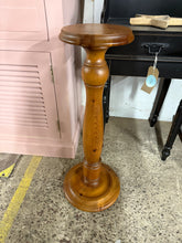 Load image into Gallery viewer, Crafted from solid pine, this wooden plant stand offers both durability and charm to your home or garden space. Its sturdy construction ensures reliable support for your favorite plants, while the natural wood finish adds a warm, inviting touch to any decor.&nbsp;

Delivery Available

Overall Dimensions

21cm diameter x 73cm high

