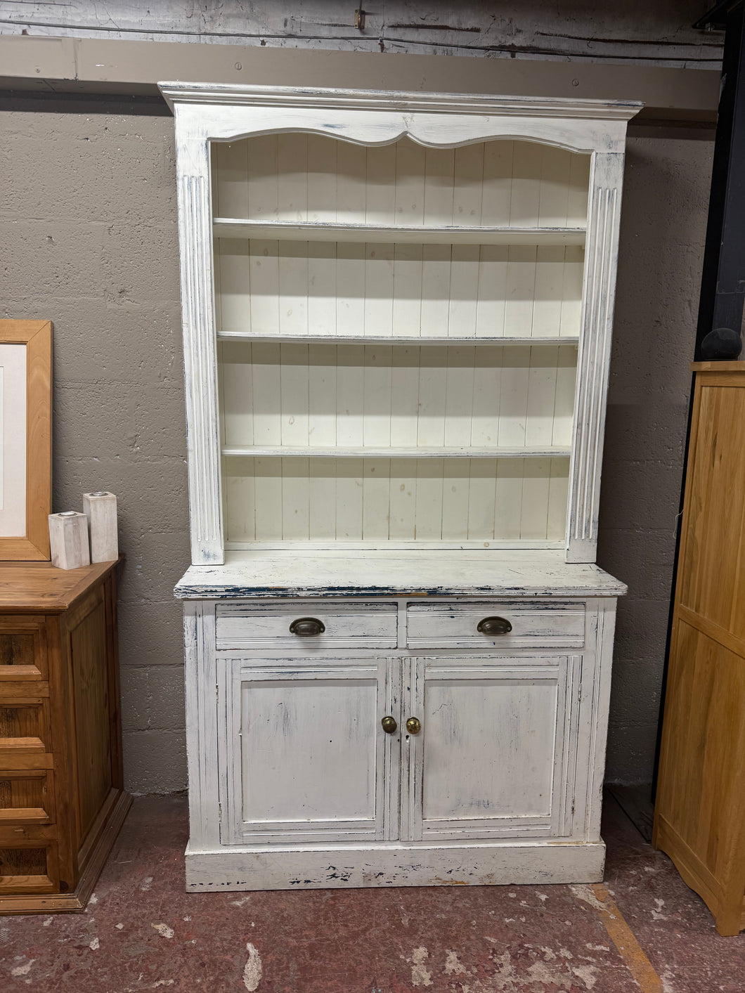 This durable distressed wooden dresser is in overall good condition and has a charming rustic appearance. It features ample storage space, including 3 top shelves above 2 dovetail jointed drawers, a double cupboard, and a shelf in the base. It also easily splits into two pieces for convenient moving.

Overall Dimensions

121cm wide x 47.5cm deep x 218cm high

DELIVERY AVAILABLE    

For our other items see our website https://fossewayfurniture.co.uk

collection from cv36 or delivery available 
