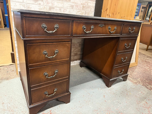 This beautiful Edwardian mahogany double pedestal desk is sturdy and generally well maintained. While it shows some minor signs of wear, they are hardly noticeable. The desk offers plenty of storage with eight short drawers featuring dovetail joints and one long drawer. It also breaks down into three parts, making it easier to move.

Delivery Available

Overall Dimensions

122cm wide x 61cm deep x 75cm high
