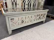 Load image into Gallery viewer, Bring vintage elegance into your home with this charming Art Deco coffee table. Boasting a pristine glass top and four practical drawers, it&#39;s perfect for storing magazines, remotes, and more. While some drawers show minor wear with small cracks, it remains fully functional and doesn&#39;t detract from this piece&#39;s timeless appeal

Overall Dimensions

120cm wide x 60cm deep x 47cm high

DELIVERY AVAILABLE      

For our other items see our website https://fossewayfurniture.co.uk

collection from our shop at CV3
