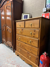 Load image into Gallery viewer, Solid pine chest of drawers featuring authentic dovetail jointed construction. Two short drawers sit above four spacious long drawers, offering practical storage for any bedroom. Structurally sound with marks that reflect its use. A sturdy, functional piece with genuine craftsmanship.

Delivery Available

Overall Dimensions

89cm wide x 42.5cm deep x 113cm high

