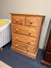 Load image into Gallery viewer, A characterful solid pine chest of drawers built to last. This sturdy piece features two short dovetail-jointed drawers over three long drawers—ideal for bedroom storage or living spaces. Shows the natural patina of age with minor marks that add to its authentic charm. Structurally sound and ready to serve another generation.

Delivery Available

Overall Dimensions

73cm wide x 48cm deep x 97cm high

