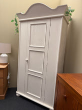 Load image into Gallery viewer, A characterful chunky pine wardrobe with solid construction and vintage charm. This pre-loved piece shows honest wear with minor surface marks and patina consistent with use. Some areas would benefit from refreshing with paint, adding to its potential for personalisation. Inside features a practical shelf and hanging rail for versatile storage

Delivery Available

Overall Dimensions

97cm wide x 49cm deep x 181cm high

