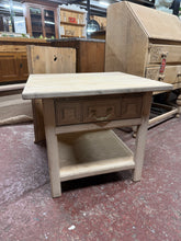 Load image into Gallery viewer, A charming stripped side table revealing beautiful natural wood grain. Returned to bare wood, it may benefit from a protective wax finish to enhance durability and appearance. Features a single dovetail-jointed drawer offering practical storage. Structurally sound and in excellent condition, this piece combines vintage character with functional design.

Delivery Available

Overall Dimensions

58cm wide x 53.5cm deep x 51.5cm high&nbsp;

