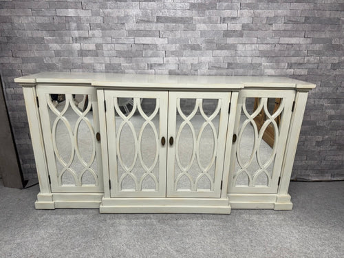 Discover the timeless elegance of this Art Deco sideboard, a versatile storage solution that combines vintage charm with practical functionality. Finished in a sophisticated off-white tone. Well-maintained and structurally robust, it features three spacious cupboards—two single and one double—each equipped with internal shelving to organise your belongings effortlessly. The natural patina from its pre-loved history adds authentic character.

Overall Dimensions

180.5cm wide x 46cm deep x 91cm high

DELIVERY