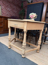 Load image into Gallery viewer, A beautiful stripped oak hall table, restored to its natural finish. The bare wood showcases the grain and character of oak, ready for your chosen protective treatment—wax, oil, or varnish. Features a single drawer for practical storage of keys, post, and everyday essentials. Structurally sound and ideal for creating a warm, welcoming entryway. A versatile piece that complements both traditional and contemporary interiors.

Delivery Available

Overall Dimensions

93cm wide x 45.5cm deep x 74.5cm high


