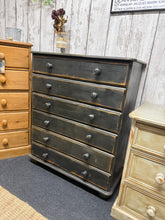 Load image into Gallery viewer, A charming black distressed pine chest featuring six spacious drawers. Hand-painted finish with distressing creates character and vintage appeal. Structurally sound and ready to enhance any bedroom or living space with practical storage and rustic style.

Delivery Available

Overall Dimensions

80cm wide x 39cm deep x 97.5cm high

