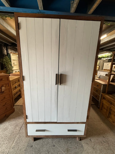 This charming two-tone wooden wardrobe is sturdy and generally well-preserved. While it has a few marks and a small missing piece on one side, these do not impact its functionality. It includes a hanging rail and a spacious drawer for storage, and it fully dismantles to make moving hassle-free.

Overall Dimensions

110cm wide x 63cm deep x 200cm high

DELIVERY AVAILABLE      

For our other items see our website https://fossewayfurniture.co.uk

collection from our shop at cv36, our collection zone at bs36 o