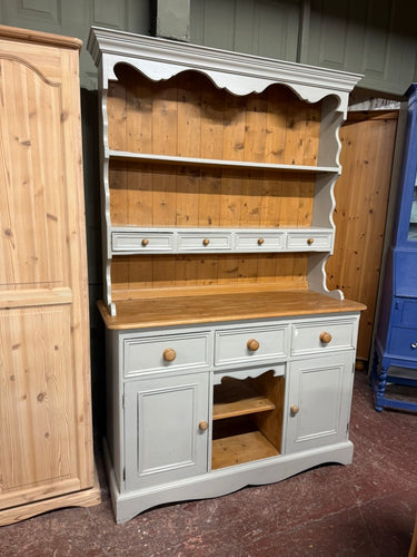 This charming solid pine dresser is painted a soft light blue by its previous owners and could use a little refresh in some spots. It offers plenty of storage, featuring 2 shelves and 4 drawers in the upper section, along with 3 drawers and 2 cupboards below. Plus, it splits into two parts to make moving simpler and more convenient.

Overall Dimensions

122cm wide x 44cm deep x 188cm high

DELIVERY AVAILABLE      

HAVE THIS PAINTED A COLOUR OF YOUR CHOICE FOR AN EXTRA £100 OR HAVE IT COMPLETELY STRIPPED BA