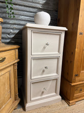 Load image into Gallery viewer, A sturdy silver-grey tallboy chest offering practical storage with three generous deep drawers. This piece shows honest character with its lived-in finish—minor surface marks add authentic vintage charm. Ideal for bedrooms or living spaces where you value functionality and understated style.

Delivery Available

Overall Dimensions

60cm wide x 51cm deep x 120cm high

