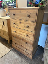 Load image into Gallery viewer, A robust solid pine chest featuring five generously proportioned drawers with traditional dovetail joinery—built to last and designed to deliver reliable storage. This well-maintained piece showcases the natural character of pine, with only light cosmetic wear that adds authentic charm. Perfect for bedrooms, living spaces, or anywhere you need dependable organisation without compromise.

Overall Dimensions

77cm wide x 41cm deep x 119cm high

DELIVERY AVAILABLE      

HAVE THIS PAINTED A COLOUR OF YOUR CHOI
