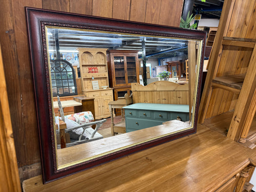 Discover the timeless elegance of this mahogany-framed mirror with its distinctive bevelled edges. Its structurally sound, this cherished piece showcases gentle signs of use that only enhance its authentic character. A delightful addition to any interior seeking classic sophistication and warmth.

Delivery Available

Overall Dimensions

98cm wide x 67cm high    
