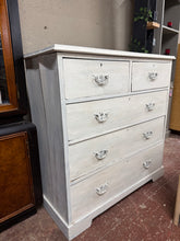 Load image into Gallery viewer, A characterful mahogany chest of drawers with authentic vintage appeal. The white-washed finish shows its history, with minor wear that adds to its charm. Structurally sound and fully functional, featuring two short dovetail-jointed drawers above three spacious long drawers—ideal for bedroom or living room storage. Minor surface marks and side splits are cosmetic only and don't affect use. A solid piece with genuine craftsmanship, perfect for those who appreciate vintage character and quality construction.

