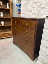 Load image into Gallery viewer, A charming period piece with authentic character, these Edwardian mahogany drawers combine practicality with timeless appeal. The solid construction features two shallow dovetail-jointed drawers above three deeper ones, offering generous storage capacity. Well-maintained and structurally reliable, they display minor surface marks. An excellent choice for adding warmth and functionality to period or eclectic interiors.

Delivery Available

Overall Dimensions

106.5cm wide x 48cm deep x 107cm high

