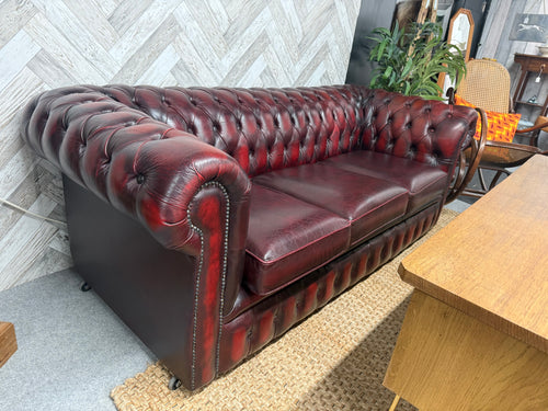 This stunning oxblood Chesterfield sofa combines classic style with comfortable seating for three to four people. Structurally sound and well-maintained, it adds a rich, warm tone to any living space. While it shows a few marks and a small rip on one cushion, these minor imperfections can be easily repaired, making it a charming and inviting centrepiece for your home. Perfect for relaxing or entertaining, this sofa brings timeless elegance and cozy comfort together beautifully.

Overall Dimensions

Approx :
