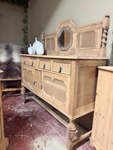 Load image into Gallery viewer, This stripped oak sideboard showcases authentic wood grain in its natural, unfinished state. Featuring two dovetail-jointed drawers and a spacious double cupboard, it offers generous storage for any room. The removable top section simplifies moving and repositioning. A light wax finish will enhance protection and bring out the wood's character. A striking focal point for hallways, dining rooms, or living spaces.

Delivery Available

Overall Dimensions

137cm wide x 49cm deep x 94cm high + 48cm high

