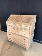 Load image into Gallery viewer, A characterful stripped oak bureau with solid construction and authentic patina. Features four dovetail-jointed drawers and a pull-down writing desk for practical storage. Used condition with minor marks consistent with age. The stripped finish would benefit from wax treatment to enhance protection and lustre. An ideal piece for those seeking genuine vintage furniture with character and functionality.

Delivery Available

Overall Dimensions

76cm wide x 40.5cm deep x 92cm high

