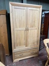 Load image into Gallery viewer, This gorgeous double wardrobe offers bags of style as well as storage. Suiting any kind of décor scheme, from the more traditional to a contemporary look, this slim oak wardrobe is a great investment piece for your bedroom. Spacious and practical too, the drawers offer storage for folded items, whilst the ample hanging space is perfect for all those long dresses. With a sleek style, and elegant design detail you will adore this piece for years to come. This is new with 2 minor marks (see photos) and RRP&#39;s a
