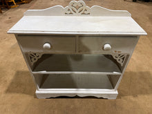 Load image into Gallery viewer, A charming solid pine bookcase with character and potential. Currently finished in white paint that shows its age, this piece features practical storage with two dovetail-jointed drawers and a single shelf. Perfect for those looking to restore a vintage find or refresh with a new colour scheme of their choice.

Delivery Available

Overall Dimensions

87cm wide x 29cm deep x 91cm high
