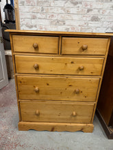 Load image into Gallery viewer, A charming solid pine chest of drawers built to last. This piece combines practical storage with timeless appeal, featuring two compact dovetail-jointed drawers above three spacious ones—perfect for organising everything from linens to keepsakes. Well-maintained overall with a few marks and knocks, it's ready to bring warmth and functionality to any room.

Overall Dimensions

93cm wide x 47cm deep x 115cm high

DELIVERY AVAILABLE      

HAVE THIS PAINTED A COLOUR OF YOUR CHOICE FOR AN EXTRA £80 OR HAVE IT C
