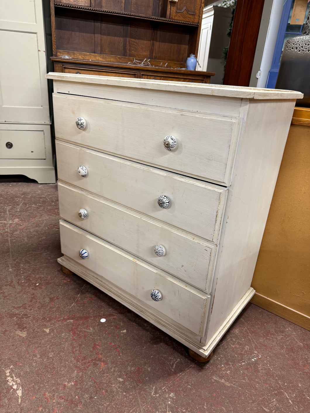 This functional wooden chest of drawers is sturdy and well-structured. Although it shows a considerable amount of wear and tear, it is the perfect piece for refurbishing with a fresh coat of paint. It offers four spacious drawers for ample storage.

Overall Dimensions

77cm wide x 43cm deep x 86cm high

DELIVERY AVAILABLE      

HAVE THIS PAINTED A COLOUR OF YOUR CHOICE FOR AN EXTRA £60 OR HAVE IT COMPLETELY STRIPPED BACK FOR JUST £70    

For our other items see our website https://fossewayfurniture.co.uk
