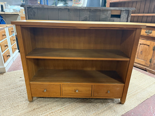 This beautiful oak bookcase is solidly built and remains in good overall shape. It shows some signs of use with minor marks, but nothing significant. It features three small drawers for storage along with a single shelf.

Delivery Available

Overall Dimensions

110cm wide x 35cm deep x 85cm high 
