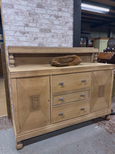 Load image into Gallery viewer, This beautiful stripped oak sideboard showcases natural wood grain and character. Returned to bare wood, it may benefit from a protective wax finish to suit your décor. Features three dovetail-jointed drawers and two cupboards—one with an additional drawer—providing generous storage. Structurally sound and in excellent condition, it's ready to become a focal point in your home.

Delivery Available

Overall Dimensions

152cm wide x 50.5cm deep x 96cm + 28cm high&nbsp;

