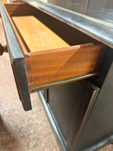 Load image into Gallery viewer, This spacious black distressed sideboard is sturdy and generally in great shape. While it shows some signs of use, the marks are minor and add character. It features two long drawers with dovetail joints above two cupboards, offering ample storage.

Overall Dimensions

156cm wide x 46cm deep x 76cm high

DELIVERY AVAILABLE      

For our other items see our website https://fossewayfurniture.co.uk

collection from our shop at CV36 4QZ or purchase online for delivery.

