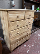 Load image into Gallery viewer, Solid pine construction with a stripped-back finish that reveals the wood's natural character. This chest combines two short drawers at the top with four long drawers below, delivering versatile storage solutions. The piece remains structurally robust and well-maintained. Consider applying wax to protect the bare timber and enhance its appearance over time.

Delivery Available

Overall Dimensions

80cm wide x 44cm deep x 98cm high&nbsp;

