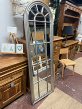Load image into Gallery viewer, This beautiful silver-framed arch mirror is solidly built and in great overall shape. Though it’s pre-loved with a few minor marks, nothing stands out too much. It also features a handy rope on the back, making it easy to hang and brighten up any space.

Delivery Available

Overall Dimensions

59cm wide x 179cm high&nbsp; &nbsp; &nbsp;

