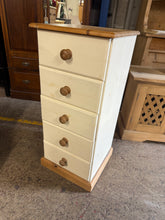 Load image into Gallery viewer, A charming solid pine tallboy with authentic character and plenty of storage appeal. This two-tone piece features five beautifully crafted dovetail jointed drawers, offering generous space for your belongings. Well-built and sturdy, it's in good working order with only a few marks

Overall Dimensions

42.5cm wide x 44cm deep x 97cm high

DELIVERY AVAILABLE      

For our other items see our website https://fossewayfurniture.co.uk

collection from our shop at CV36 4QZ or purchase online for delivery.

