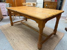 Load image into Gallery viewer, A charming solid pine refectory table that's ready to become the heart of your dining space. This well-loved piece boasts authentic character with its patina of gentle wear, while remaining structurally excellent and in fine working order. Comfortably accommodates 6-8 guests, making it ideal for family gatherings and entertaining. A timeless addition that brings warmth and character to any home.

Overall Dimensions

180cm long x 95cm wide x 79.5cm high

DELIVERY AVAILABLE      

HAVE THIS PAINTED A COLOUR O
