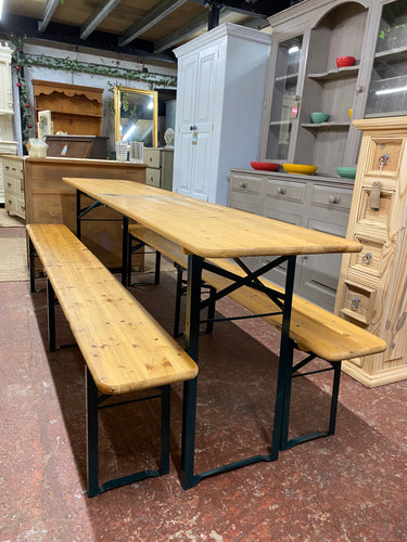 This neat solid pine foldable table and bench set is structurally sound and in overall good condition. It does unfortunately have some marks but nothing that will not come out with a sand. The legs are a dark green / blue in colour. This is the perfect set for those who love to entertain but dont have the space. The legs fold up and both benches and table fold in half for easier storage.

Overall Dimensions

Table measurements : 218cm long x 45.5cm deep x 74cm high 

DELIVERY AVAILABLE    

For our other it