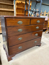 Load image into Gallery viewer, A solid mahogany chest featuring five dovetail-jointed drawers—two short and three long—offering generous storage capacity. The piece shows its age with surface marks and patina, though these can be minimised with careful polishing. Structurally sound and ready to serve as a functional addition to any room.

Delivery Available

Overall Dimensions

109.5cm wide x 52.5cm deep x 95cm high

