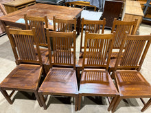 Load image into Gallery viewer, A set of eight sturdy hardwood dining chairs with warm, natural tones. Each chair is in solid working condition with only light surface marks that reflect their use. Ideal for furnishing a spacious dining area, these chairs combine practicality with timeless appeal.

Delivery Available

Overall Dimensions

approx : 50cm wide x 45cm deep x 106cm high&nbsp;&nbsp;

