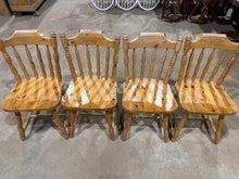 Load image into Gallery viewer, A matching set of four pine chairs which are structrually sound. Light wear marks are present but nothing major. Ideal for buyers seeking vintage style seating—ready to furnish a rustic kitchen immediately or tackle as a satisfying restoration project.&nbsp;

Delivery Available

Overall Dimensions

approx : 45cm wide x 42cm deep x 85cm high&nbsp;&nbsp;

