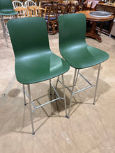 Load image into Gallery viewer, This pair of green stools offers reliable seating for your kitchen counter or breakfast bar. Both pieces are in good working condition with minimal surface marks from everyday use. The understated green finish works well with various interior styles, making them a versatile addition to your home. Perfect for creating extra seating without compromising on practicality or aesthetics.

Delivery Available

Overall Dimensions

47cm wide x 40cm deep x 82.5cm / 115cm high

