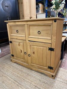 This sweet pine sideboard is structurally sound and in good condition. It is used and does have some marks but nothing too major. One of the cupboards needs a catch to keep it shut but that's nothing major at all. It has 2 drawers over a double cupboard for storage.

Overall Dimensions

86cm wide x 40cm deep x 77cm high 

DELIVERY AVAILABLE    

HAVE THIS PAINTED A COLOUR OF YOUR CHOICE FOR AN EXTRA £60 OR COMPLETELY STRIPPED BACK FOR £70 

For our other items see our website https://fossewayfurniture.co.uk