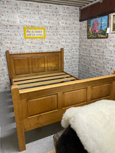 Load image into Gallery viewer, This lovely chunky kingsize pine bed is structurally sound and in overall good condition. It does have a few scratches etc to the wood but nothing major at all. It all dismantles down for easier moving. It takes a 5ft mattress.

Overall Dimensions

166.5cm wide x 213cm long

headboard height 114cm

footboard height 89cm 

DELIVERY AVAILABLE    

HAVE THIS PAINTED A COLOUR OF YOUR CHOICE FOR AN EXTRA £120 OR COMPLETELY STRIPPED BACK FOR £130 

For our other items see our website https://fossewayfurniture.co.
